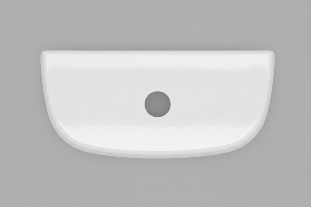A white ceramic toilet tank lid with a single black hole in the center, photographed from directly above on a dark textured surface.  N2316TL