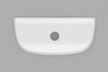 A white ceramic toilet tank lid with a single black hole in the center, photographed from directly above on a dark textured surface.  N2316TL