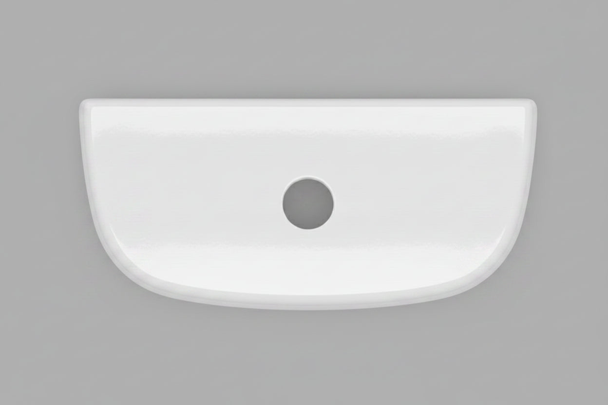 A white ceramic toilet tank lid with a single black hole in the center, photographed from directly above on a dark textured surface.  N2316TL