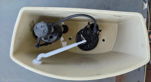 American Standard 4021 white toilet tank interior and installed flushing components