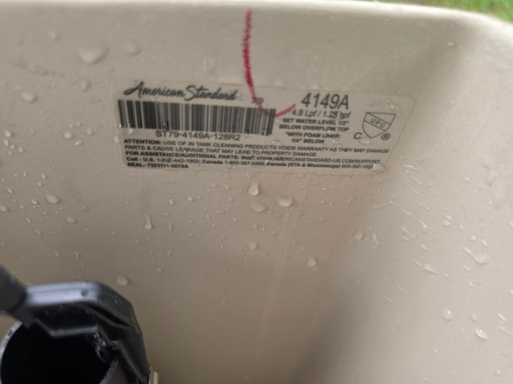 American Standard 4149A toilet tank model label showing 1.28 GPF