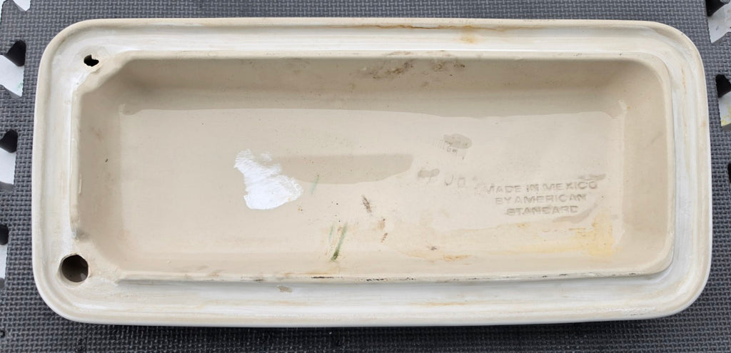 Underside of original American Standard 735100 white toilet tank lid