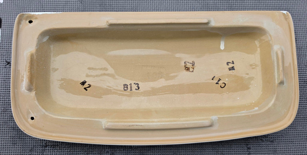 Underside of original American Standard 735140 white toilet tank lid