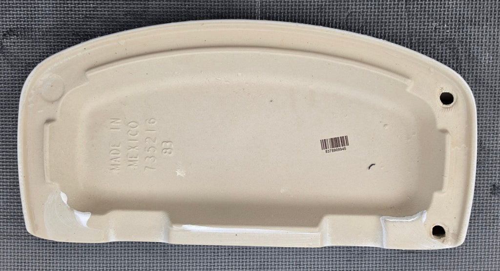 American Standard 735216 white toilet tank lid underside showing molded part number
