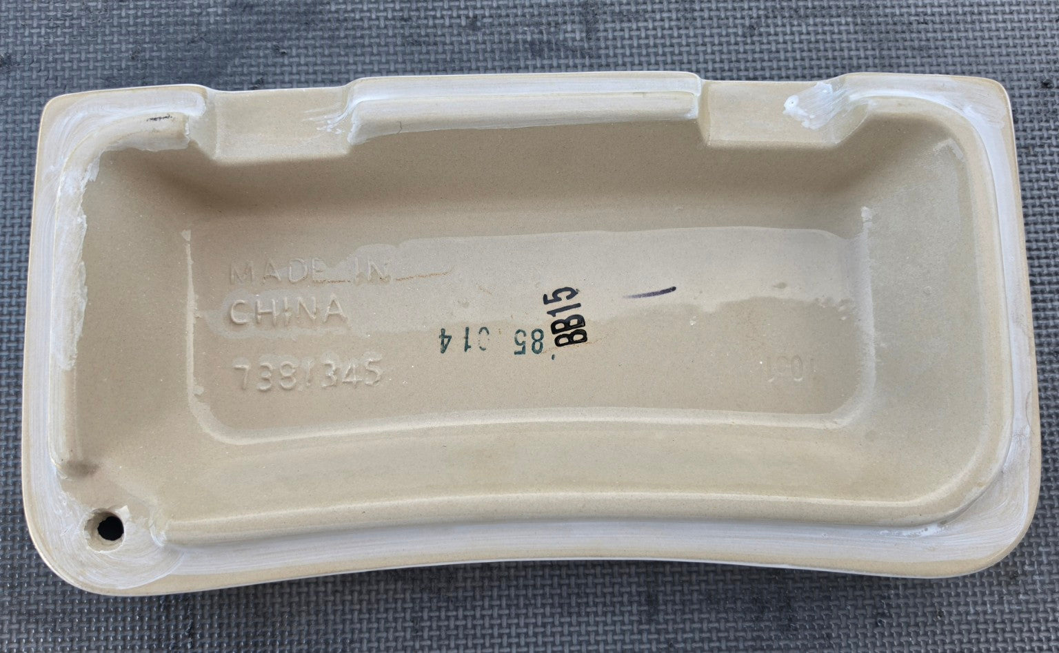 American Standard 735228 white toilet tank lid underside showing 7381345 marking