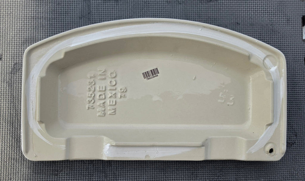 American Standard 735231 white toilet tank lid underside showing part number for 4215A tank
