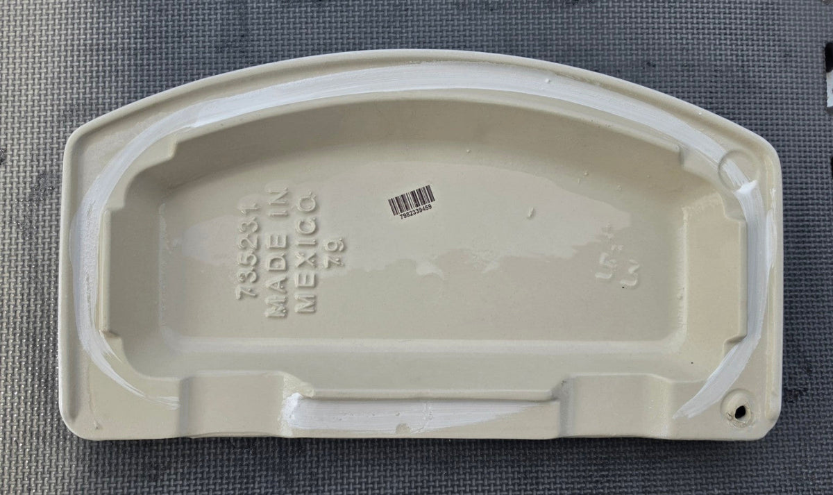 American Standard 735231 white toilet tank lid underside showing part number for 4215A tank