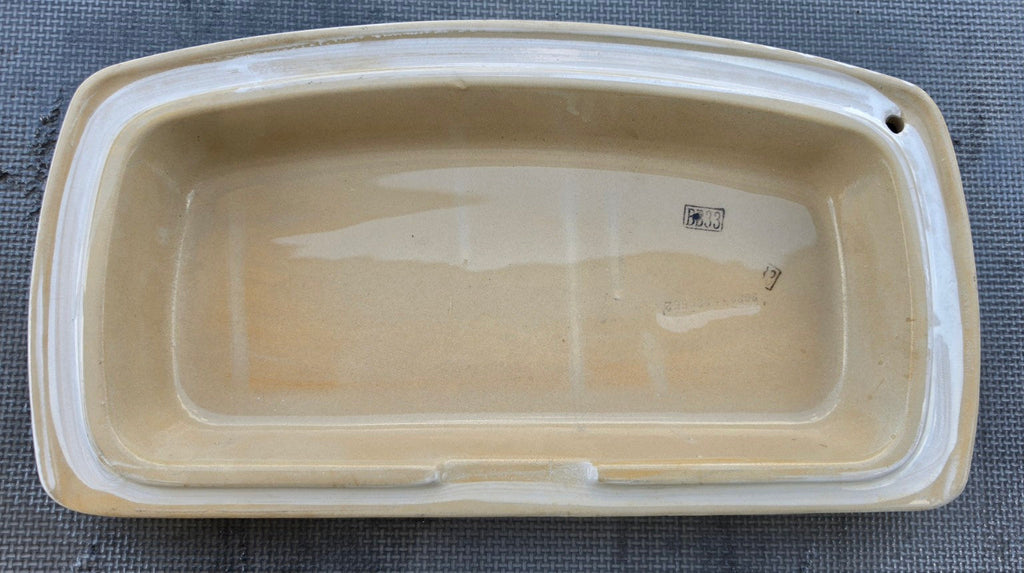 Delta RP82448WH white toilet tank lid underside showing identification marks and fitting rim
