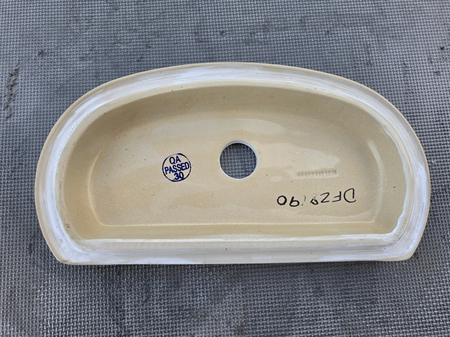 Gerber DF-28-190 white toilet tank lid underside showing factory markings