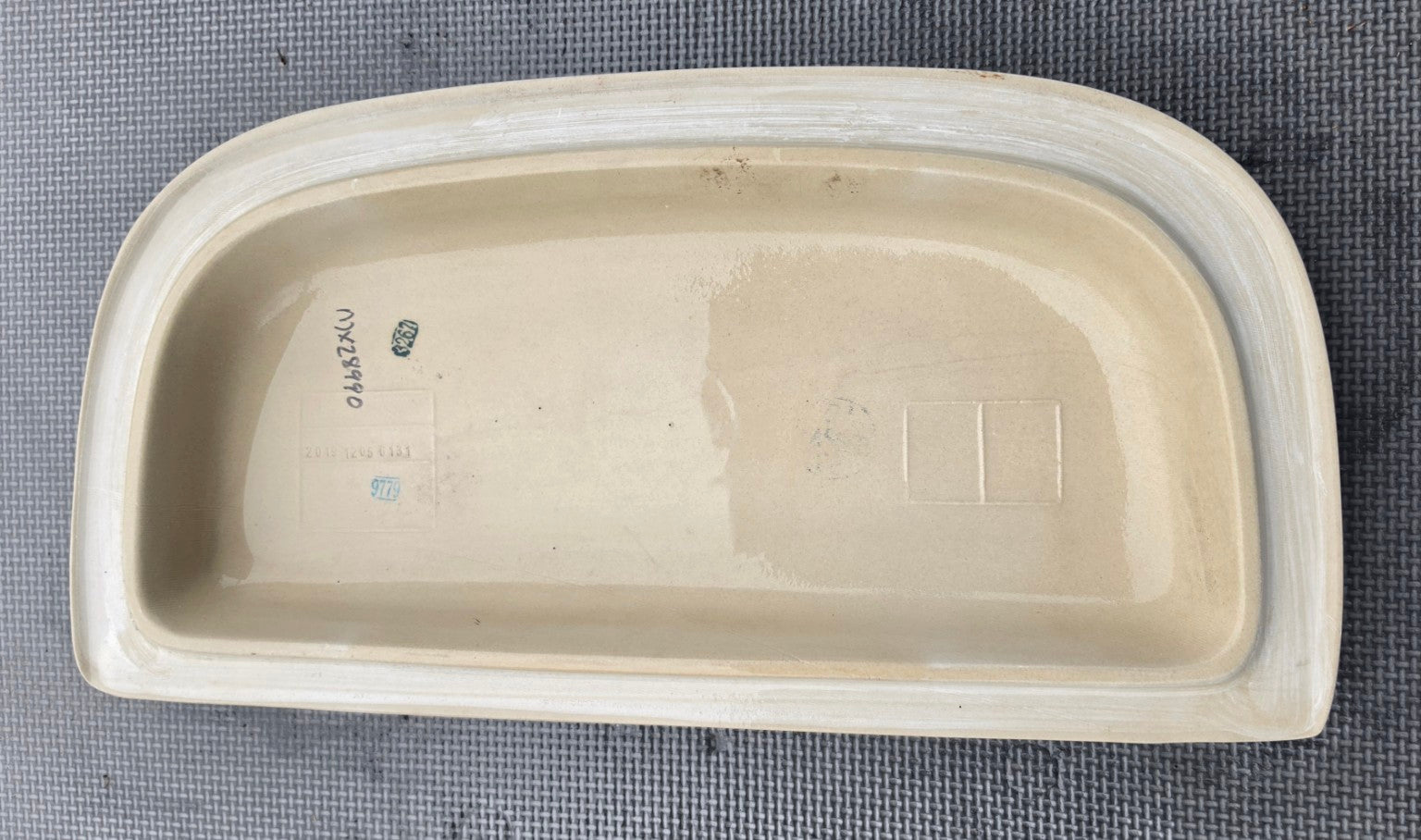 Underside markings of white Gerber 28-179 tank lid for MX-28-990 and 28-170 Maxwell SE