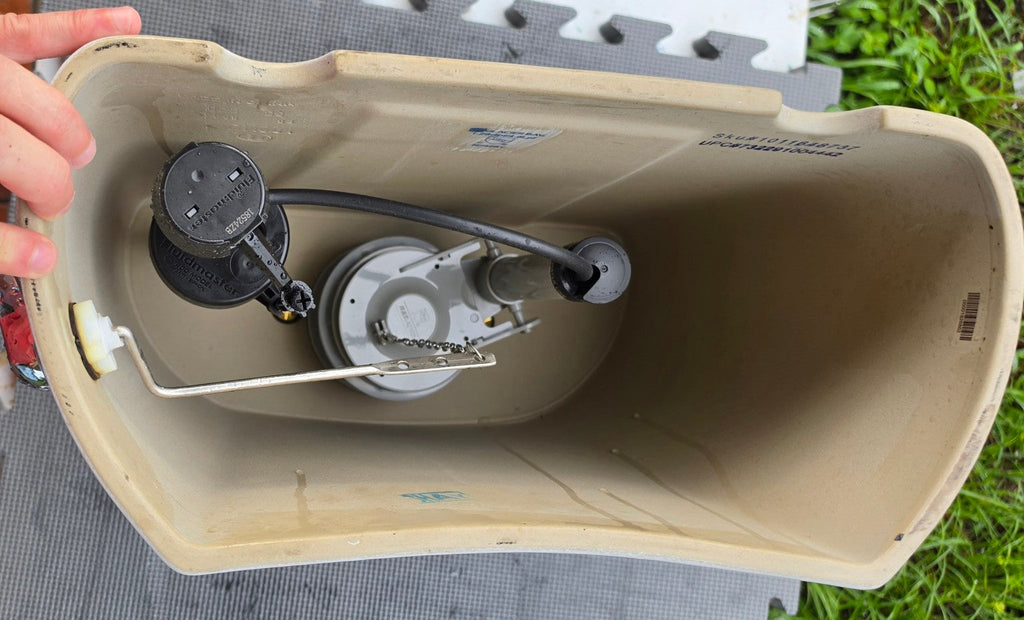 Inside view of Glacier Bay Niagara N2428T white replacement toilet tank