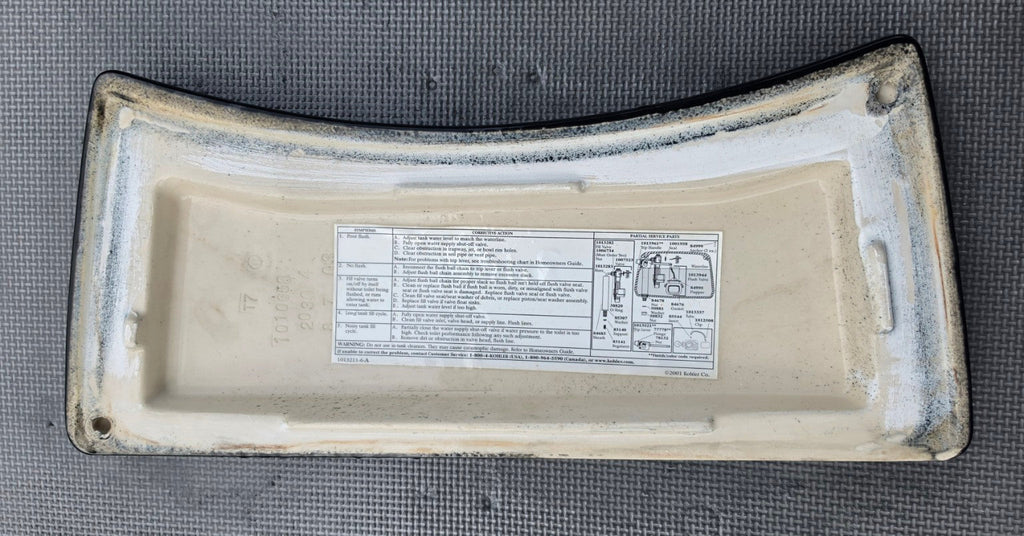 Kohler 1010658 black toilet tank lid underside and stamp