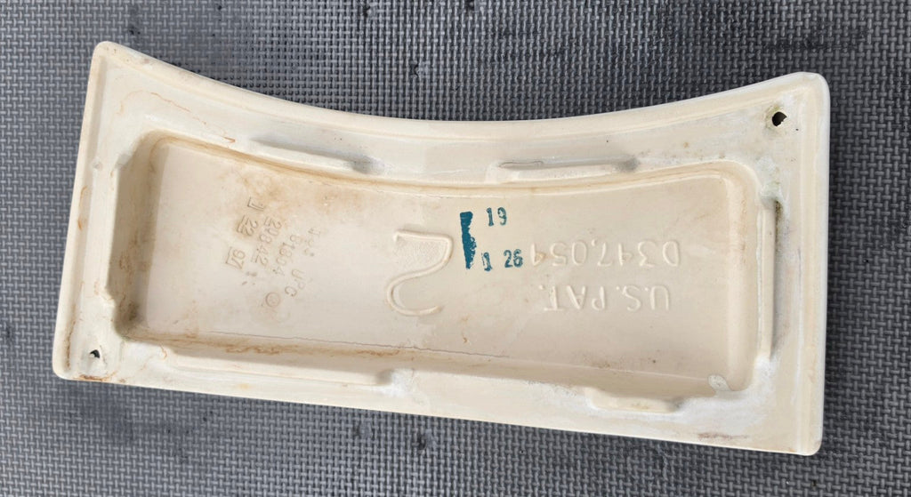 Kohler 81804 white toilet tank lid underside showing stamped part number