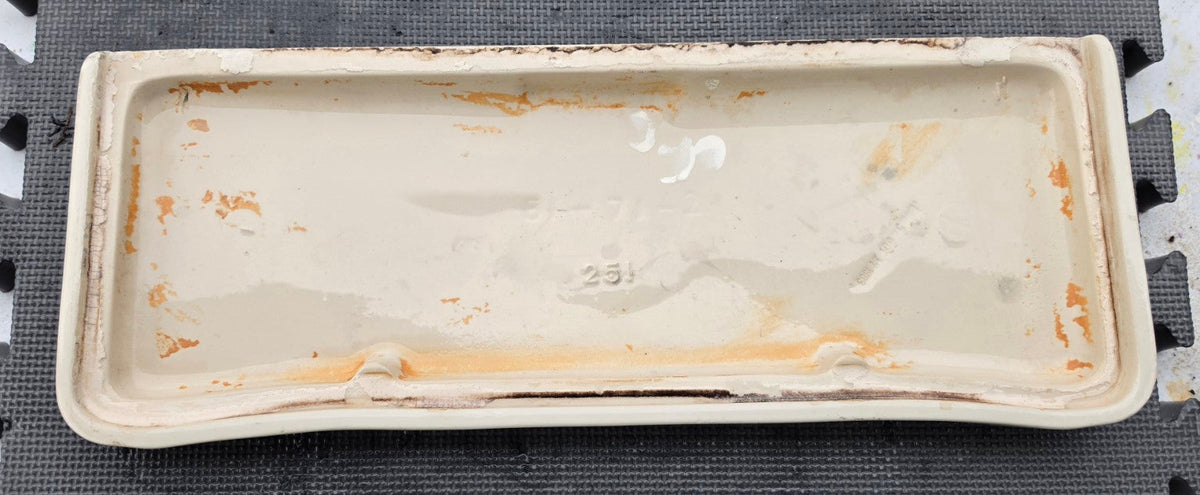 Underside of original Mansfield 51 Almond toilet tank lid showing casting and fit for tank 35