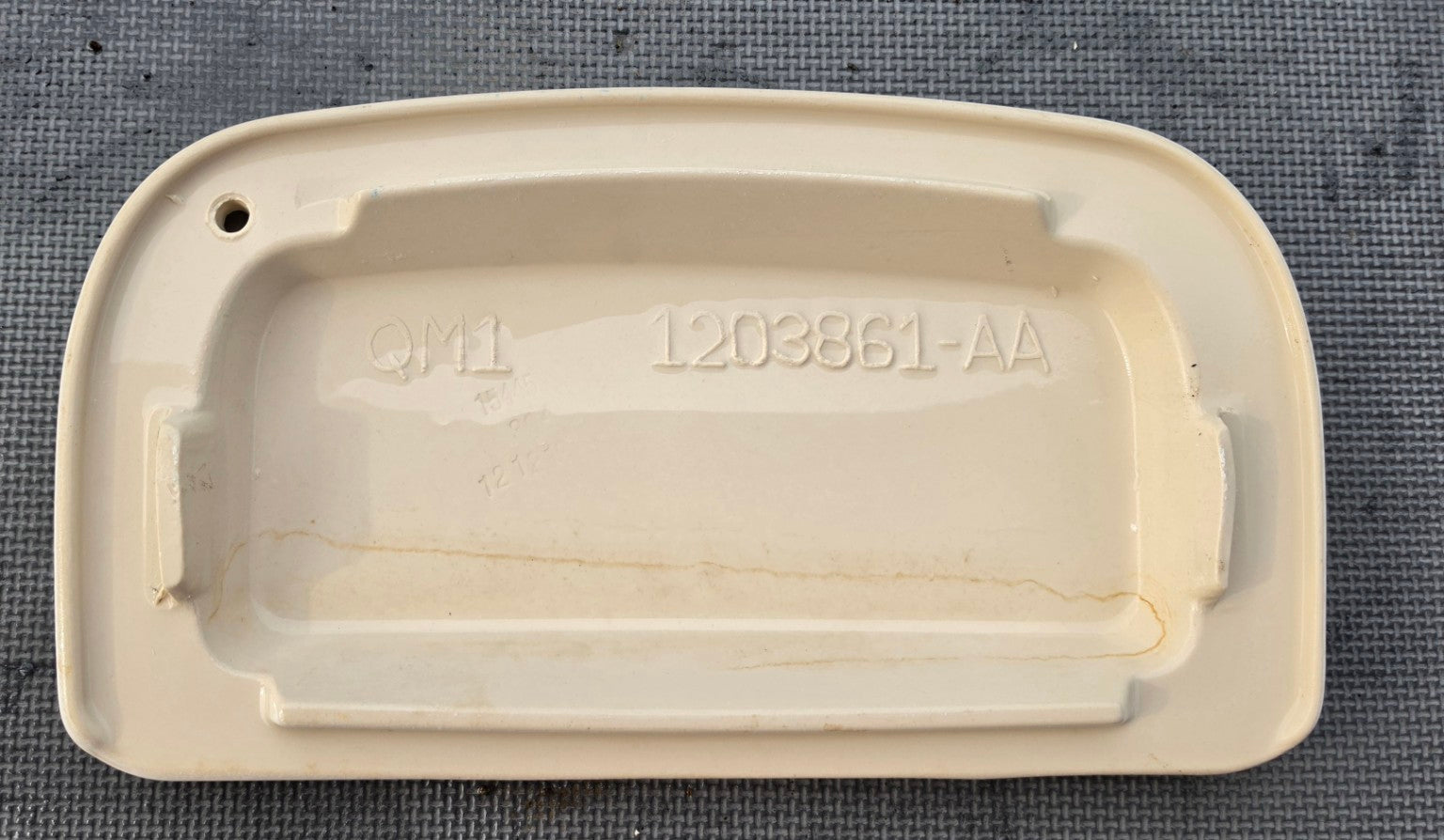 Sterling 1203861-AA white toilet tank lid underside showing model number