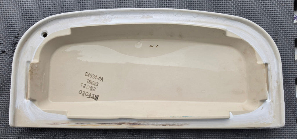Sterling 84624-AA white toilet tank lid, underside with part-number marking