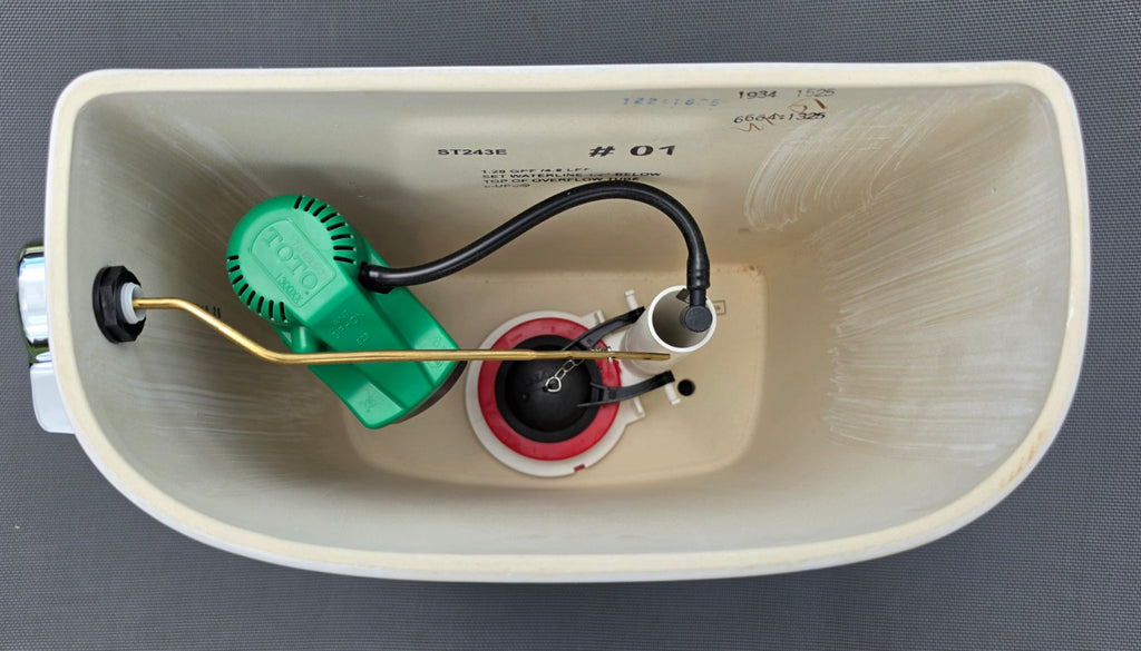 TOTO ST243E white toilet tank interior and model marking