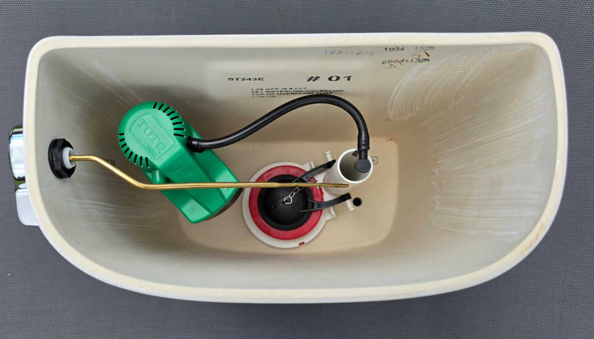 TOTO ST243E white toilet tank interior and model marking