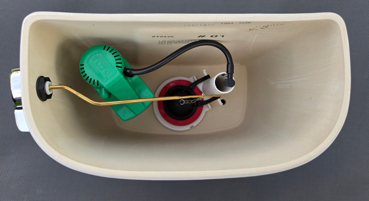 TOTO ST743E white toilet tank interior showing model marking and components