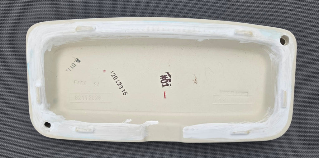 TOTO ST776 toilet tank lid in White, underside showing touch-up finish