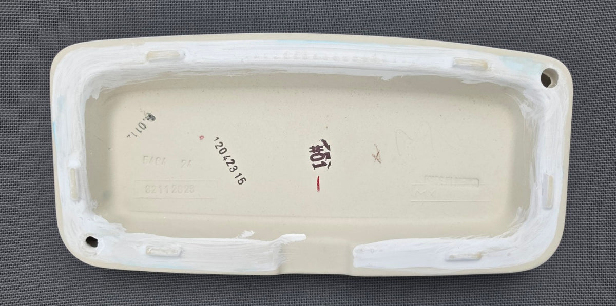 TOTO ST776 toilet tank lid in White, underside showing touch-up finish