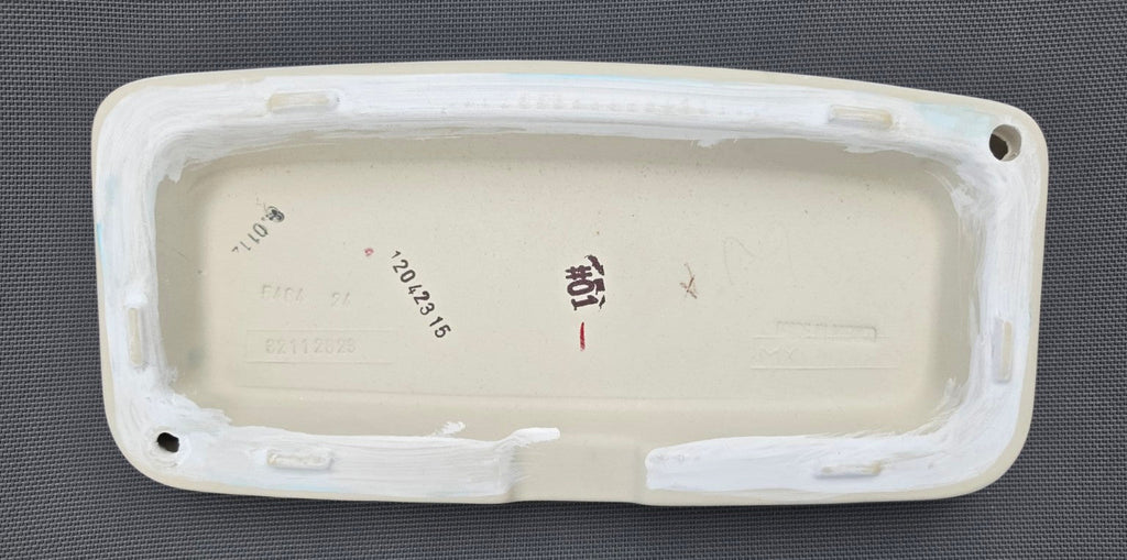 TOTO ST776 toilet tank lid in White, underside showing touch-up finish
