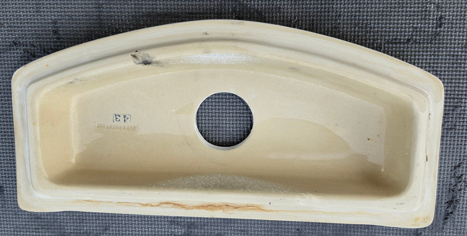 Water Ridge C22133C white dual flush toilet tank lid underside showing center button opening